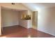 This living room features a vaulted ceiling, wood flooring and a passthrough into the kitchen for easy communication at 208 Afton Sq # 307, Altamonte Springs, FL 32714