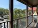 Enjoy a relaxing view from this balcony, overlooking lush greenery and the building's charming architecture at 224 Afton Sq # 301, Altamonte Springs, FL 32714