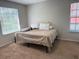 Simple bedroom with a large window letting in natural light at 224 Afton Sq # 301, Altamonte Springs, FL 32714
