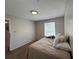 A cozy bedroom featuring neutral walls and carpet at 224 Afton Sq # 301, Altamonte Springs, FL 32714