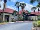 Community clubhouse with palm trees and manicured landscaping at 224 Afton Sq # 301, Altamonte Springs, FL 32714