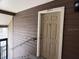 Unit 301 features a beige entry door on a brown wood-paneled wall at 224 Afton Sq # 301, Altamonte Springs, FL 32714
