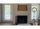 Bright living room with fireplace and view of the backyard at 224 Afton Sq # 301, Altamonte Springs, FL 32714