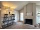 Cozy living room with decorative shelving, fireplace, and neutral decor at 224 Afton Sq # 301, Altamonte Springs, FL 32714