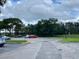 A well maintained parking lot with several cars surrounded by lush landscaping at 224 Afton Sq # 301, Altamonte Springs, FL 32714