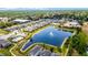 Breathtaking aerial view of the community, showcasing the pool, water feature, and green landscapes at 2264 Emerald Springs Dr, Apopka, FL 32712