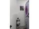 Neat bathroom corner with decorative shelving, towels, and a stylish shower curtain at 2264 Emerald Springs Dr, Apopka, FL 32712