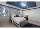 Bright bedroom features blue accent walls, hardwood floors and neutral decor at 2264 Emerald Springs Dr, Apopka, FL 32712
