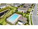 Aerial view of a community pool area with ample seating and lush landscaping at 2264 Emerald Springs Dr, Apopka, FL 32712