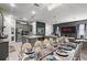 Elegant dining area with a decorated table and gray kitchen island, perfect for Gathering meals and entertaining guests at 2264 Emerald Springs Dr, Apopka, FL 32712