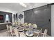Charming dining space featuring a decorative table and sliding barn door, ideal for Gathering gatherings and entertaining at 2264 Emerald Springs Dr, Apopka, FL 32712