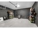 Well-organized garage with sleek concrete flooring and black brick walls, providing ample storage space at 2264 Emerald Springs Dr, Apopka, FL 32712