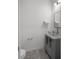 Cozy half-bathroom with a unique vessel sink, tiled floor, and minimalist decor at 2264 Emerald Springs Dr, Apopka, FL 32712