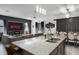 Open-concept kitchen and living area with granite island and seating, ideal for entertaining and Gathering gatherings at 2264 Emerald Springs Dr, Apopka, FL 32712