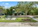 Attractive neighborhood playground with seating area, offering a secure recreational space for families at 2264 Emerald Springs Dr, Apopka, FL 32712