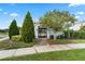 Inviting gated entrance to a community pool area with lush landscaping and beautiful trees at 2264 Emerald Springs Dr, Apopka, FL 32712