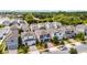 Street view of a modern home with two-car garage, framed by landscaped front yard at 2264 Emerald Springs Dr, Apopka, FL 32712
