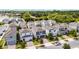 Street view featuring modern two-story homes with landscaped yards and brick paved driveways at 2264 Emerald Springs Dr, Apopka, FL 32712