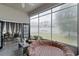 Bright and airy sunroom with a hot tub, comfortable wicker seating, and plenty of natural light at 2264 Emerald Springs Dr, Apopka, FL 32712