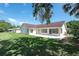 A spacious backyard and patio offer ample outdoor living and entertainment space at 23 Old Sunbeam Dr, South Daytona, FL 32119