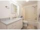 A clean bathroom with updated vanity, mirror, and shower-tub combo at 23 Old Sunbeam Dr, South Daytona, FL 32119