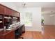 Functional home office featuring a built-in desk, storage, and a window for natural light at 23 Old Sunbeam Dr, South Daytona, FL 32119