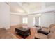 Bright living room boasts hardwood floors, vaulted ceilings, and an abundance of natural light, creating an inviting and airy atmosphere at 23 Old Sunbeam Dr, South Daytona, FL 32119