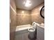 Cozy bathroom featuring modern tile, a tub with shower and a white vanity at 232 W Lafayette St, Winter Garden, FL 34787