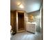 Tiled bathroom with a walk-in shower, white vanity, and a toilet with an open lid, and a window at 232 W Lafayette St, Winter Garden, FL 34787
