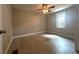 Cozy bedroom featuring modern flooring, neutral colors, natural light and a ceiling fan at 232 W Lafayette St, Winter Garden, FL 34787