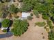 Lush aerial view of the home surrounded by beautiful trees at 237 W Mcclendon St, Lady Lake, FL 32159