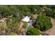 Overhead view of property with dense, mature trees at 237 W Mcclendon St, Lady Lake, FL 32159