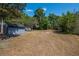 Large and expansive backyard featuring a detached shed at 237 W Mcclendon St, Lady Lake, FL 32159
