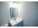 Modern bathroom featuring a vanity with brushed nickel faucet and a framed mirror at 237 W Mcclendon St, Lady Lake, FL 32159