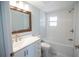 Modern bathroom featuring updated fixtures, a bath and shower combo, and a white vanity at 237 W Mcclendon St, Lady Lake, FL 32159