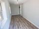This room boasts wood-look floors and natural light from the windows at 237 W Mcclendon St, Lady Lake, FL 32159