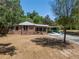 Attractive brick home with well-maintained landscaping and a convenient carport at 237 W Mcclendon St, Lady Lake, FL 32159