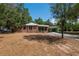 Charming brick home with a covered carport and a spacious front yard at 237 W Mcclendon St, Lady Lake, FL 32159