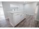 The kitchen has new floors, modern cabinets, and a center island at 237 W Mcclendon St, Lady Lake, FL 32159