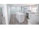 Updated kitchen with a center island, stylish backsplash, and updated appliances at 237 W Mcclendon St, Lady Lake, FL 32159