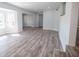 Bright, freshly painted living room featuring new floors and large windows at 237 W Mcclendon St, Lady Lake, FL 32159