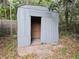 Metal shed with block foundation and red brick paver entrance at 237 W Mcclendon St, Lady Lake, FL 32159