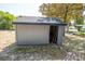 Backyard storage shed with open doorway at 237 W Mcclendon St, Lady Lake, FL 32159