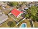 Spacious fenced backyard featuring a refreshing in-ground pool and eye-catching red roof at 2426 Abbey Ave, Orlando, FL 32833