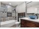 Inviting bathroom with a soaking tub, unique tile work, and stylish vanity, perfect for unwinding after a long day at 2426 Abbey Ave, Orlando, FL 32833