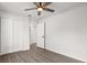 Bedroom featuring a ceiling fan, hardwood flooring, and a closet with white paneled doors at 2426 Abbey Ave, Orlando, FL 32833