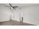 Bright bedroom features wood-look floors, multiple closets, and a ceiling fan at 2426 Abbey Ave, Orlando, FL 32833