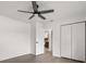 Bedroom featuring a ceiling fan, hardwood flooring, and closet with white paneled doors at 2426 Abbey Ave, Orlando, FL 32833
