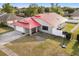 Charming home with a red roof, attached garage, and well-kept lawn at 2426 Abbey Ave, Orlando, FL 32833