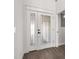 Up close look at an elegant front door with decorative glass panels and black hardware at 2426 Abbey Ave, Orlando, FL 32833